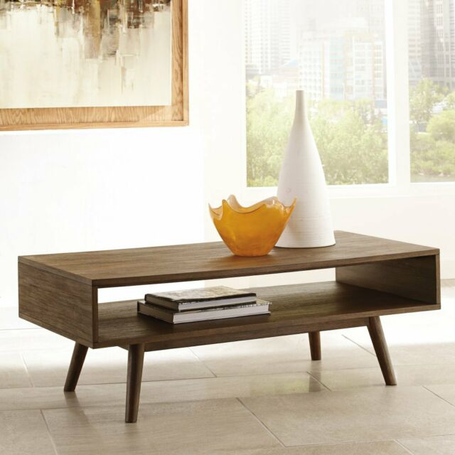 Baybrin Rustic Brown Rectangular Cocktail Table (T587-1) by Ashley .