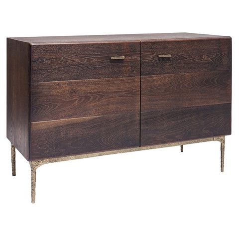 A solid oak sideboard with a bronzed cast iron base and matching .