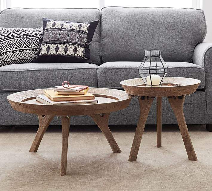 Be different and add multiple sized coffee tables to your living .