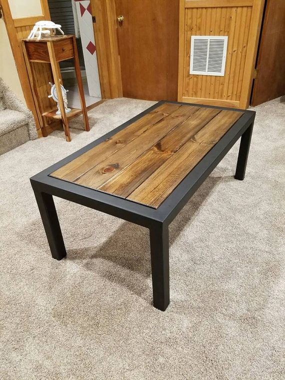Hand made coffee table with a flat black finish. The top is a .