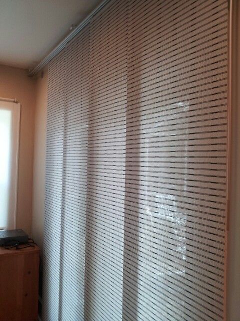 Ikea curtain covering french doors. Much better than verical .