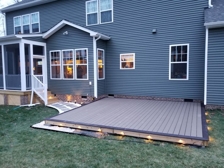 Diy ground level composite deck. Led lighting. Stone border in .