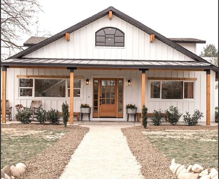 Love the black accents on the porch poles! | Barn house plans .