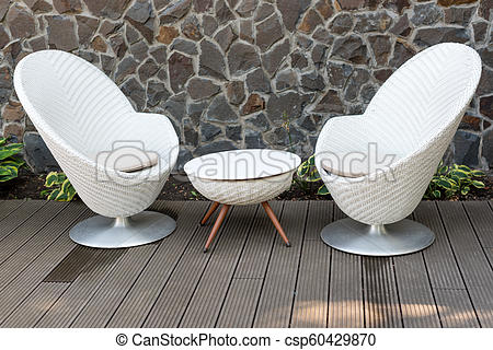 Modern white armchairs and table, modern garden furniture. cozy .