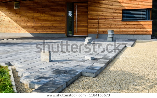 Laying Gray Concrete Paving Slabs House | Industrial Stock Image .