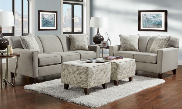 Casual two-piece set with sofa and loveseat in upholstered gray .