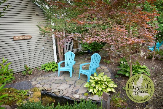 Beautiful Backyard with fish pond and campfire ring! - Picture of .