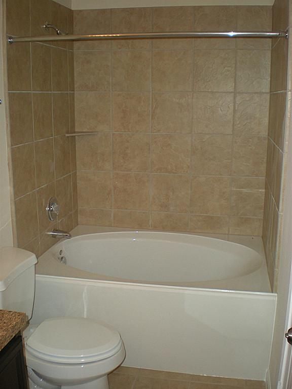 Master bathe with garden tub and shower combo. | Bathtub shower .